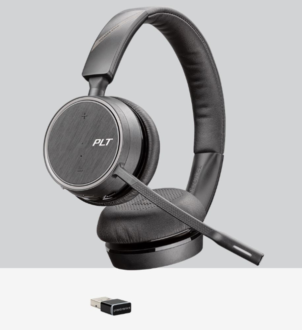 A Voyager 4200 UC stereo headset is on display with a USB adatper next to it. 